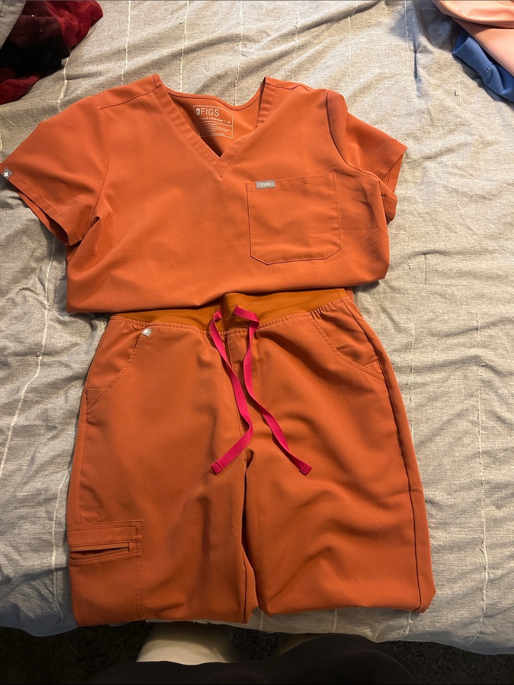 Figs Two-Piece Orange Scrub Set with Pink Drawstring